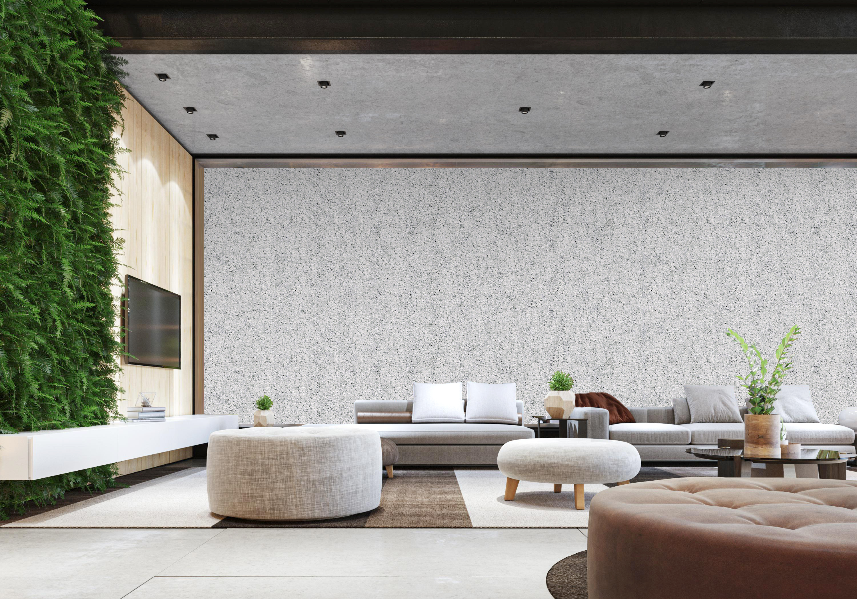 Helles modernes Wohnzimmer mit großer grauer Betonoptik-Wand, Sofas, Poufs, Pflanzen und vertikaler Begrünung als inspirierendes Wohnambiente